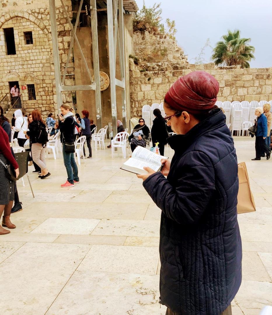 A woman in prayer.