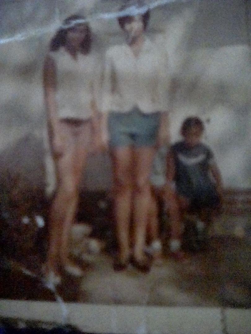 My sister Sharon and me. My little sister's Sandy and Cheryl sitting down behind us. 1965 Milw. Wisc.