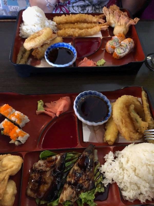 Bento boxes. Shrimp tempura and mackerel teriyaki.
