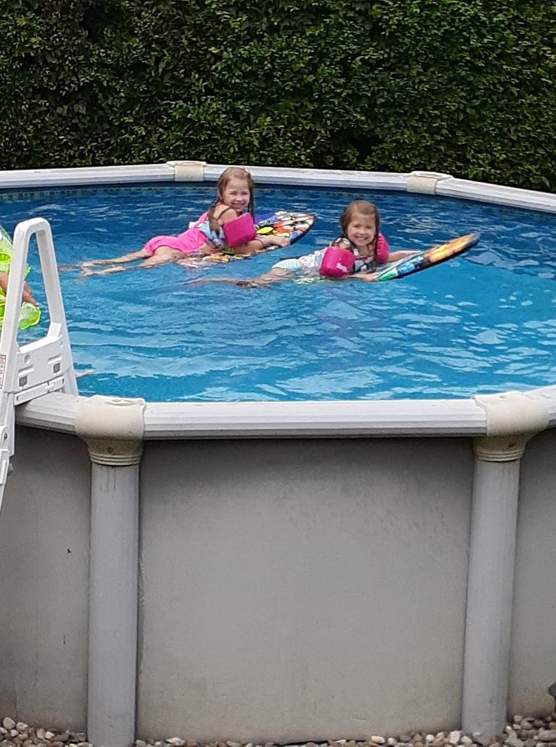 Boogie boards in pool.