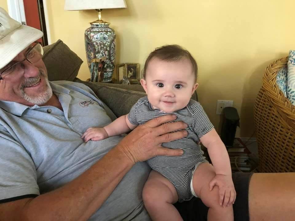 Little Charlotte watching car shows with her Papa.