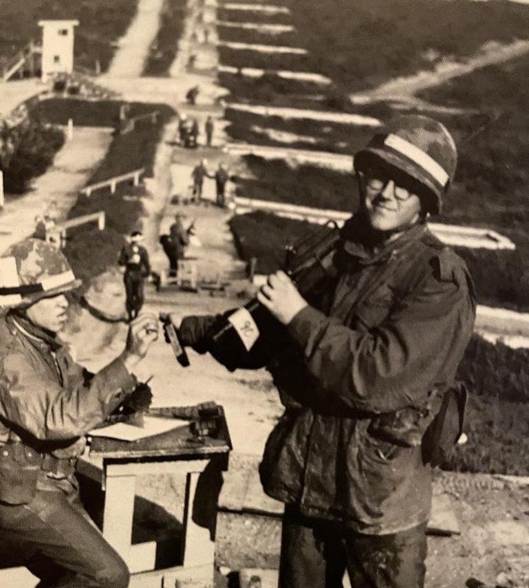 1971, 17 yrs old, Fort Ord, Basic Training.. Just completed 1st Weapons Qualification with the M16, SharpShooter. CPT Carter walking up the hill looking down range at my targets and noticed I shot my M16 left handed while I