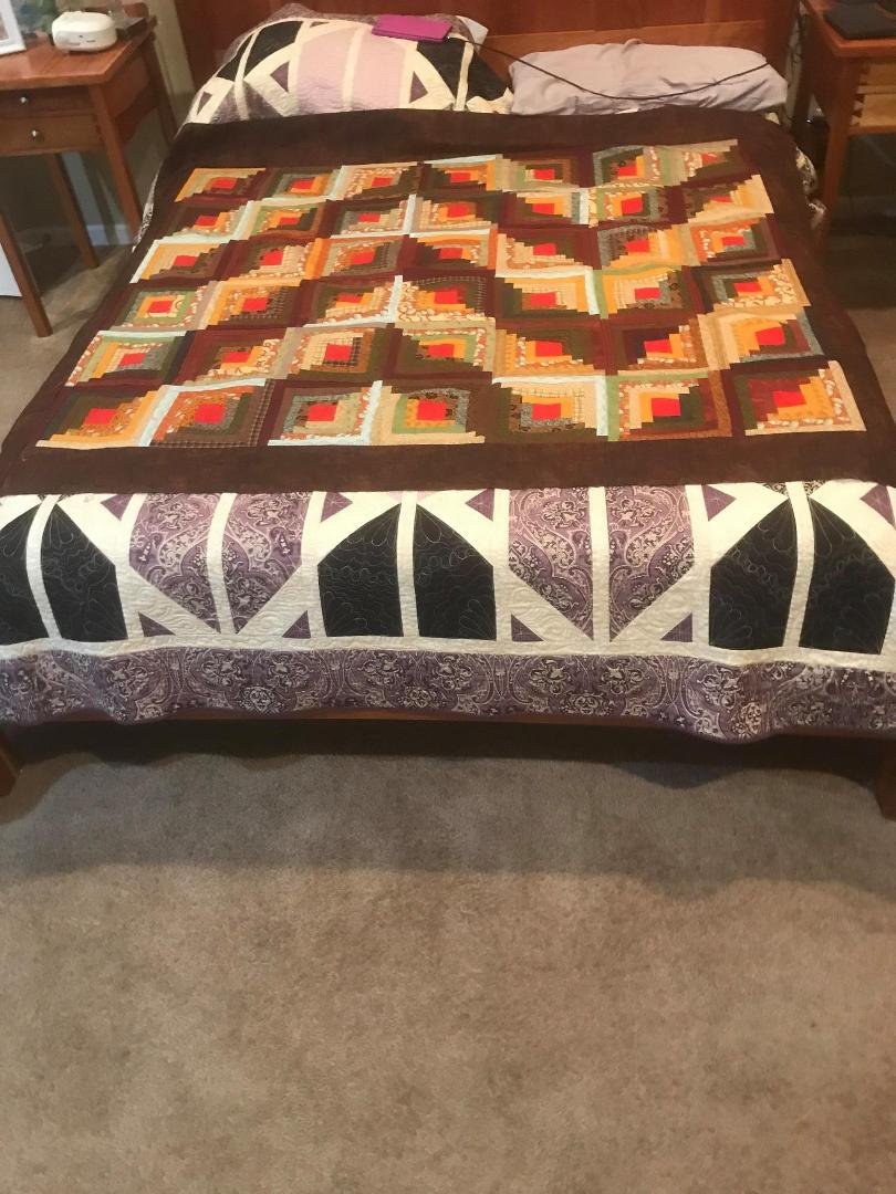 50 Years of scraps into a log cabin quarantine quilt.