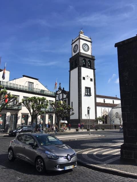 Finally, after six days at sea and 3 days of storm we have found land. It is a nice day with sunshine and some wind. The Cafe is just across from the church.