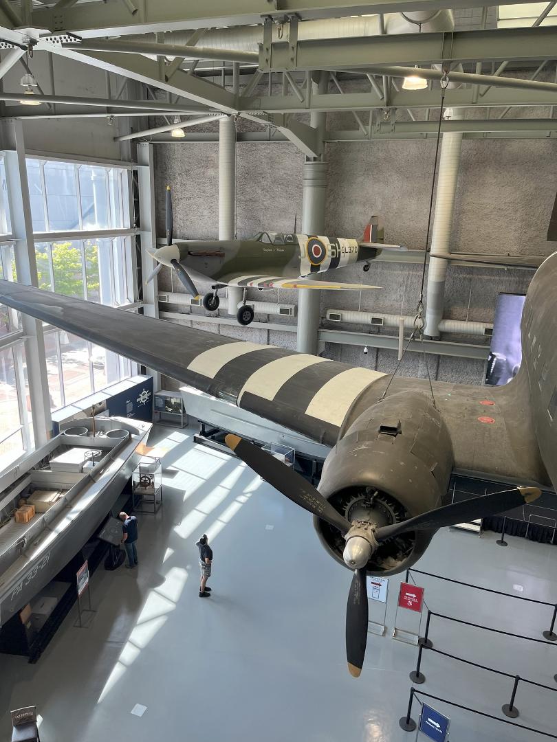 British Spitfire airplane in the background with foreground of a C47 engine