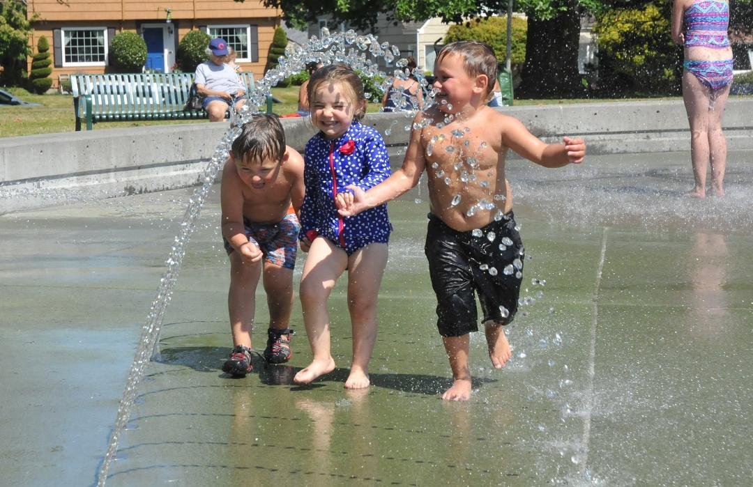 Danny, Lucy, and Christian having a blast at the spray park
