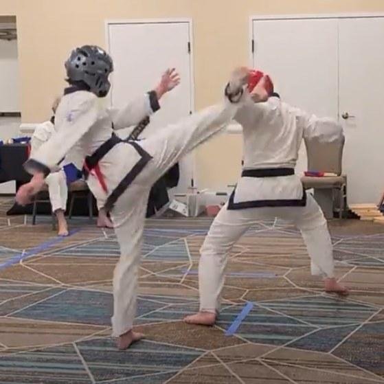 My son on the left sparring in the Oregon Moo Duk Kwan 13th annual tournament. His opponent (and friend) Sam is a tough competitor, and my son has not trained in 2 months to play football. But he pulled off a win after a t