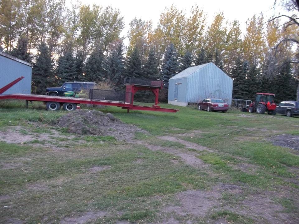 Trailer, tractor, old cars