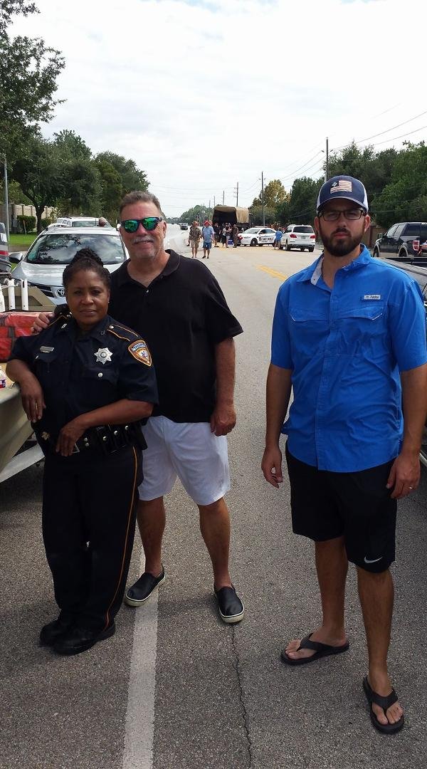 Officer Tanya, our escort, me, Ryan, the boat owner from Corpus at our staging area on Eldridge south of Little York. We evac'd Twin Lakes Subdivision and The Lakes of Eldridge subdivision.