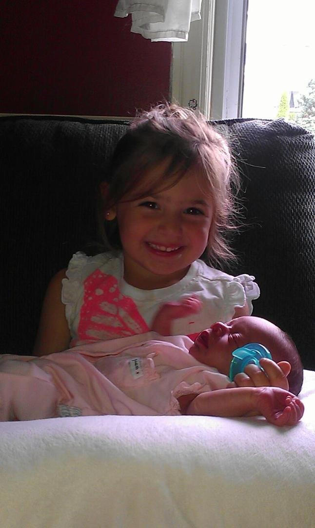 Two of my beautiful granddaughters. Madelyn being a great big sister!!