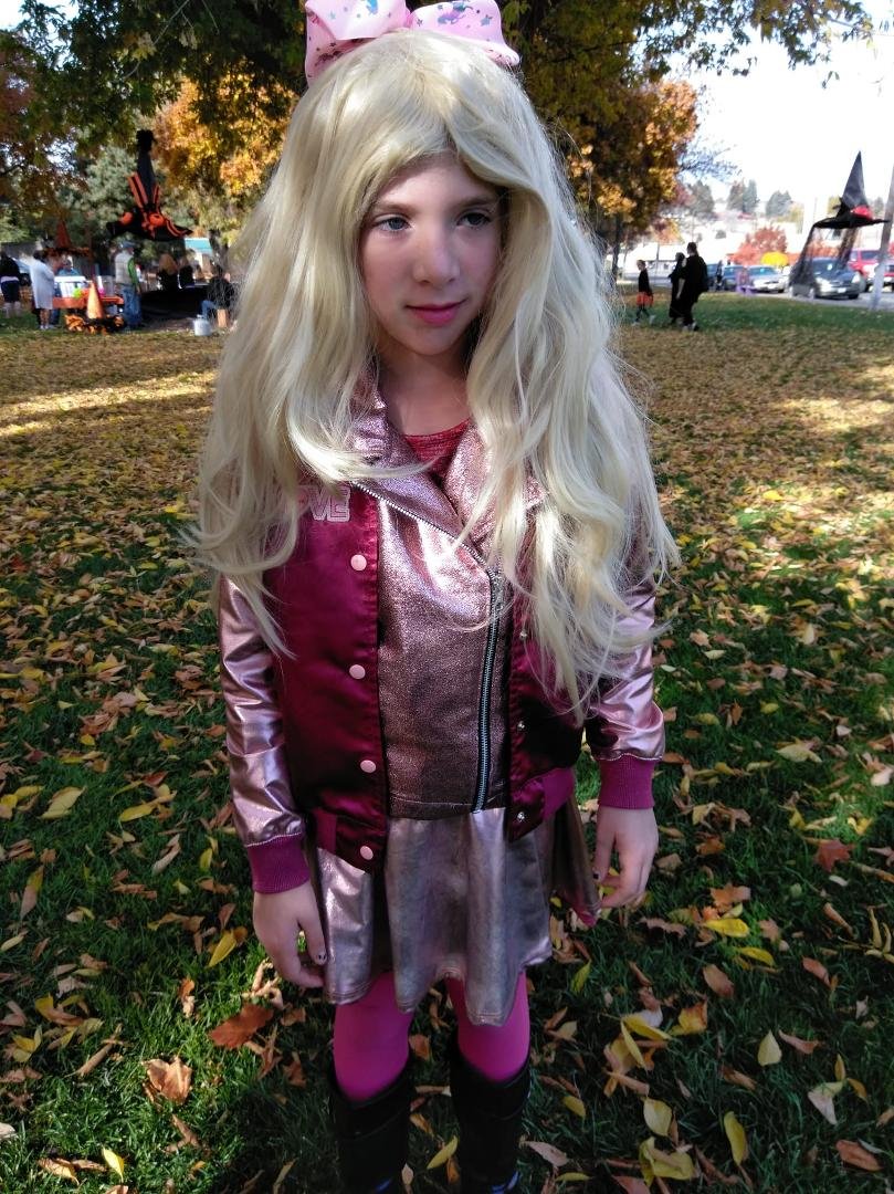 Lizzie as JoJo Sewa. I had to post this from the weekend because she couldn't keep the wig on long enough for Halloween pictures!