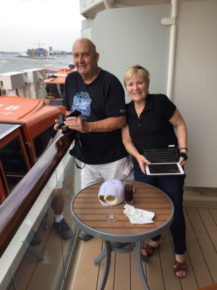 Jim and Jane on the balcony sailing out of Amsterdam.