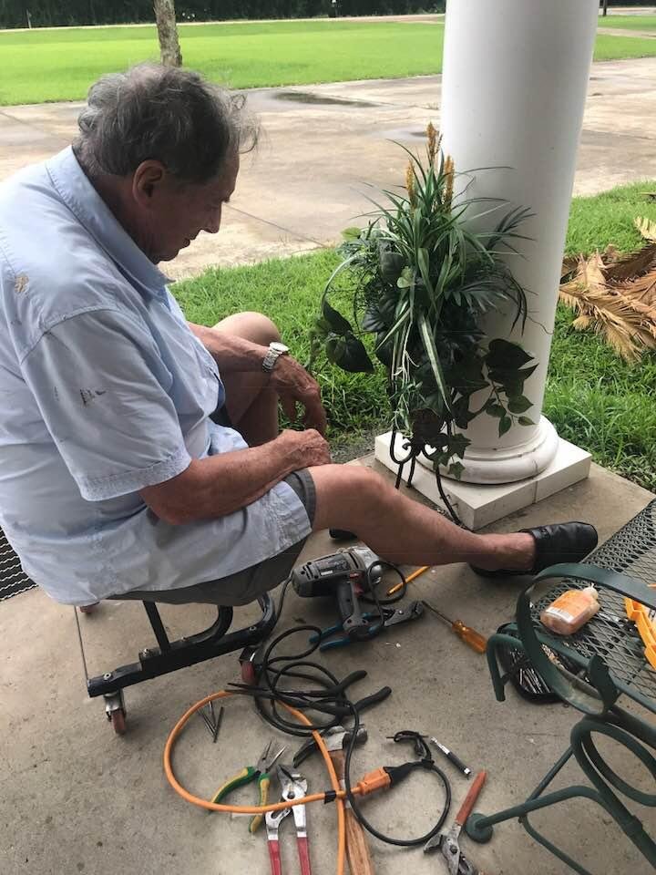 My husband attaching my Mother’s Day gifts from my step daughter, Marilyn.