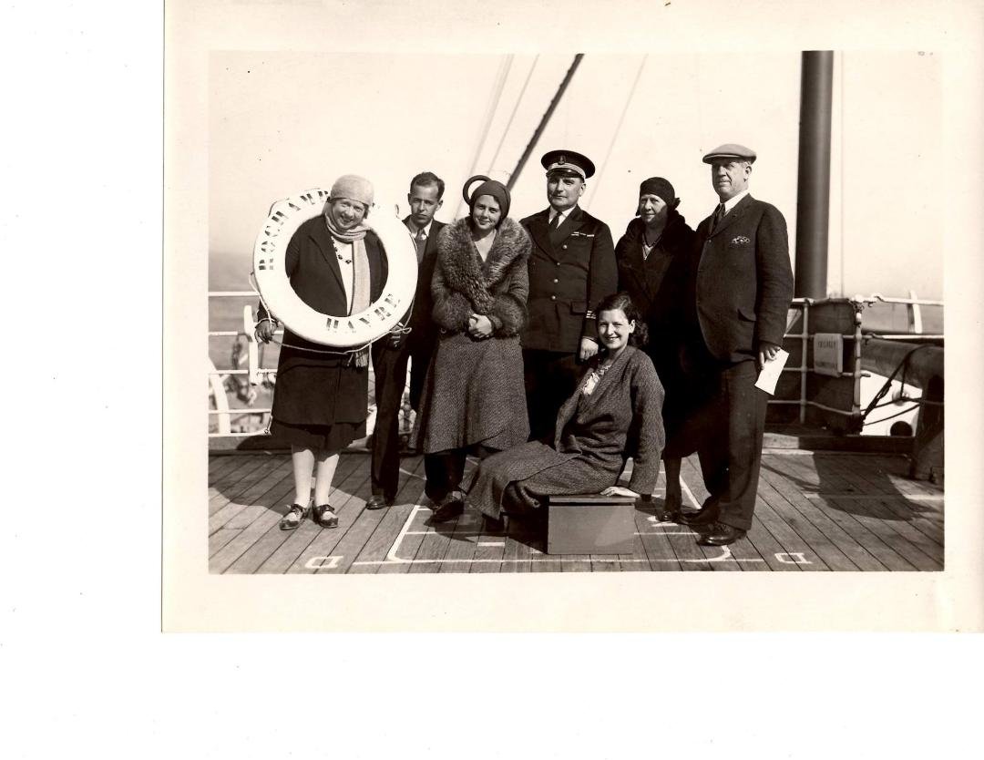 This is My Grand Father Going on A Cruise in The Early 1900's,What ship He was on, is a question to me.There is a Woman with a Life Preserver around her neck,What ship is that from,it is hard to read,can anyone help me????