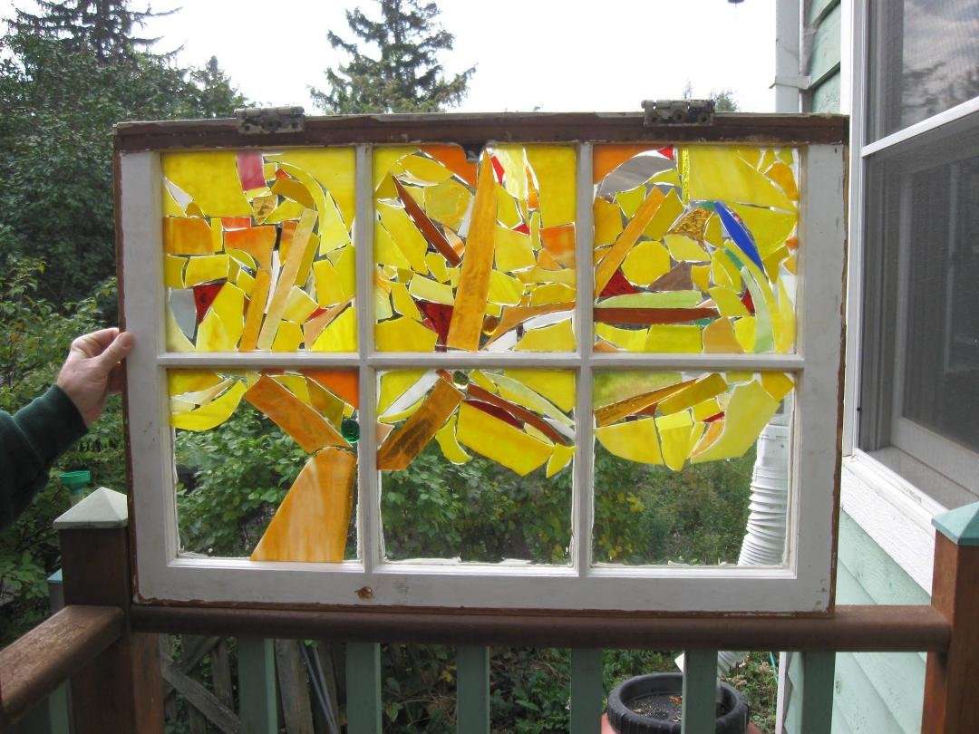 This window lives in a Unitarian Church member's home. I use recycled windows and scrap glass.
I can make this tree design in colors of your choice.