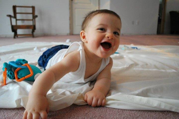 This is lil' Gavin when he was a lot younger than now. He's laughing because he thinks he's getting away with something by touching the carpet.