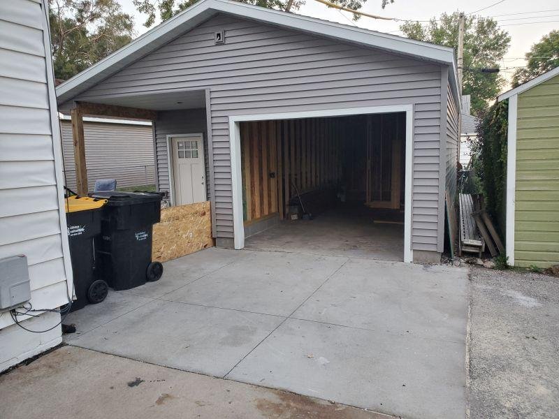 Progress!  Garage rough wired and inspected....Framework inspected (both passed!).  Interior work begins shortly.  Insulation and walls, then wiring the shop portion.  This looks much better than a bare slab!   It will be t