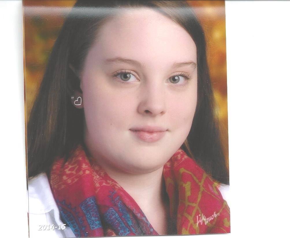 Here's this year's school picture. Hard to believe she's a Junior already.