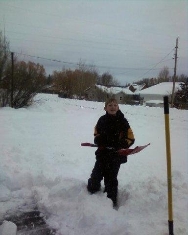 Dylan shoveling and watching Pepe James shovel the roof...