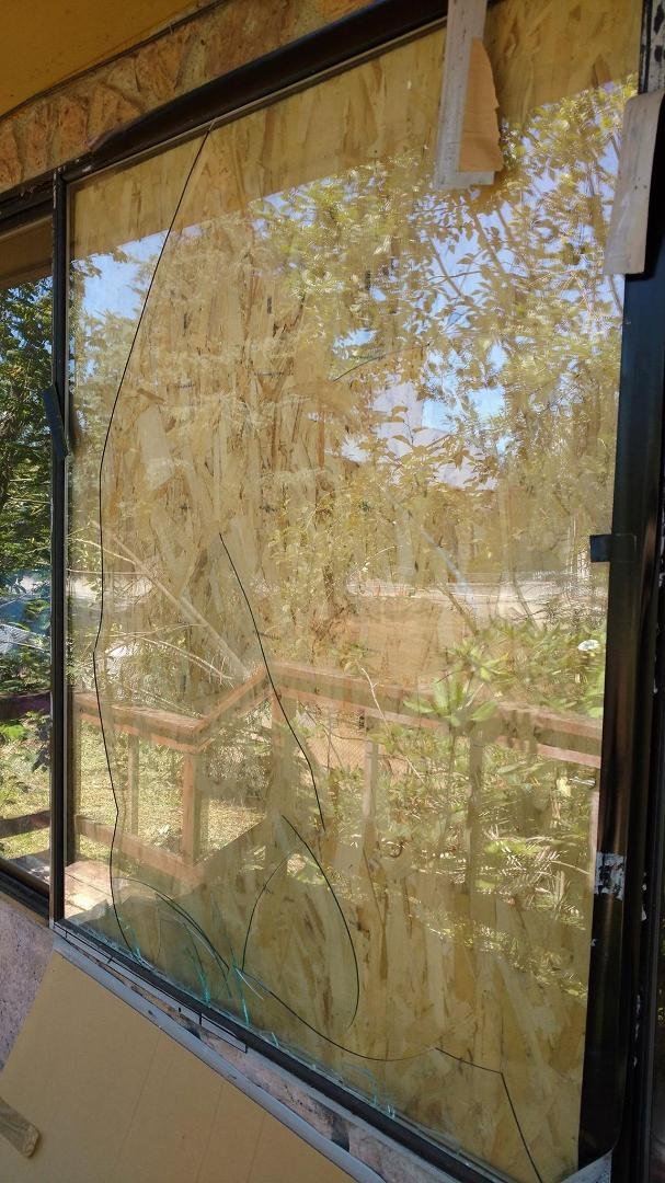 BROKEN DINING ROOM WINDOW BOARDED UP INSIDE INSTEAD OF OUTSIDE