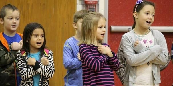 Here's Bella, on the school district's home page. This was at the Thanksgiving morning program. (Her bff Riley is on the right, too).