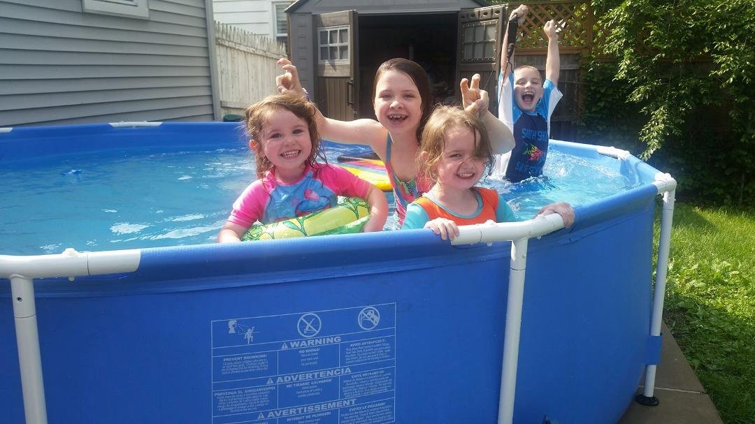The little  girls first summer in the big kid pool