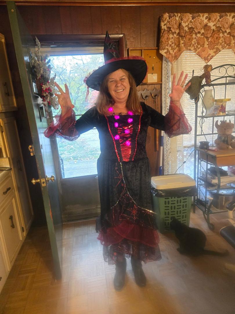 Getting ready to hand out some candy. Did not know kit kit was photo bombing me lol