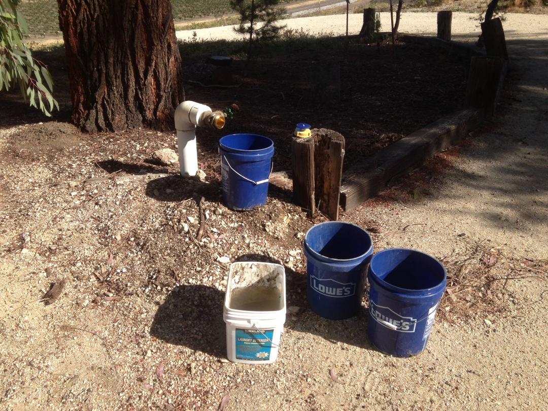 WELL, Chris and I got our first real taste of rural life. Last evening as we were getting ready to out to an event at our favorite winery I noticed water flowing down the property near the well and storage tank. It was our