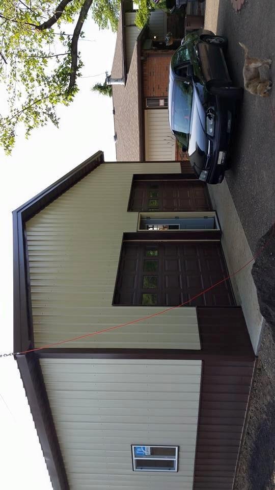 Last overhead door installed, other landscaping to do.