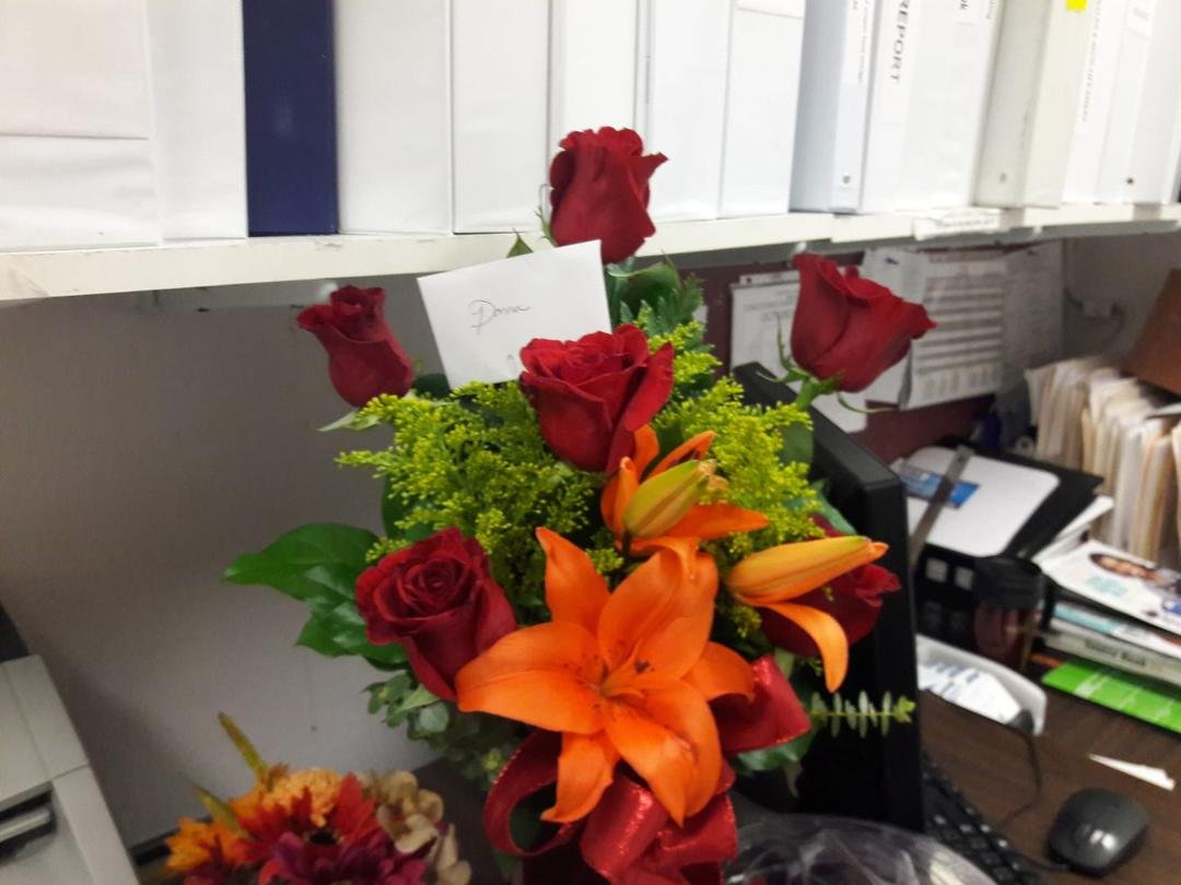 The beautiful flowers my boss gave me for my first bosses day shes so sweet. Thank you Lucy.