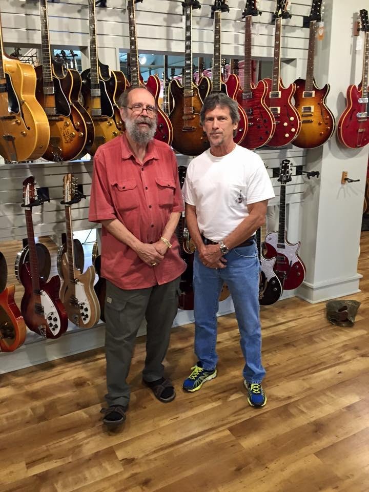 With George Gruhn at his new store in Nashville. Many Holy Grails. Still drooling. Bought a guitar strap. Happy birthday George. And happy 45th for Gruhn's Guitars.