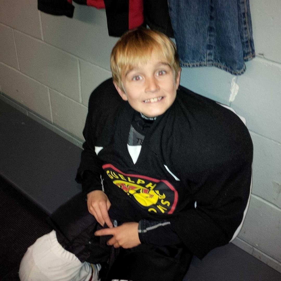 My son Ethan and Hockey! Waiting for practice! On the ice all the time