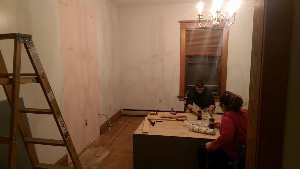 First piece of demolition in the new house.  The dirty grey built in had to go.  Now we see they the room was pink at one time.