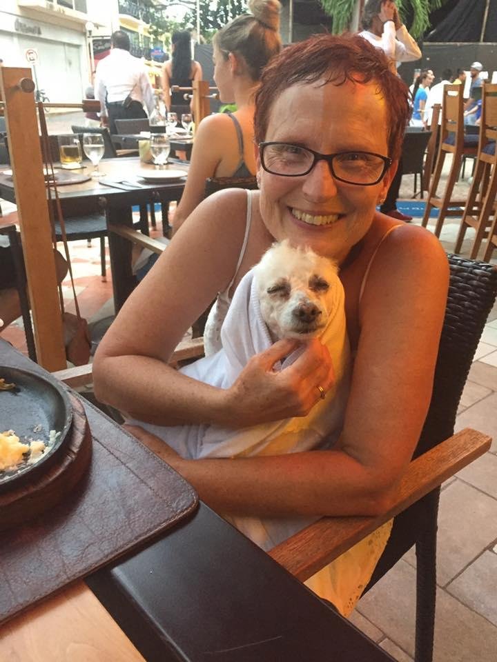 How a dog can be cold in the tropics is beyond me....