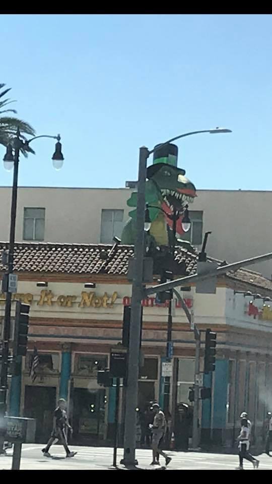 While sitting at a traffic light on Hollywood Blvd., I whipped out my camera and took a pic of Godzilla bursting out of the roof of “Ripley’s Believe It Or Not Museum”. 😲 His costumes change for each season/holiday. Looks