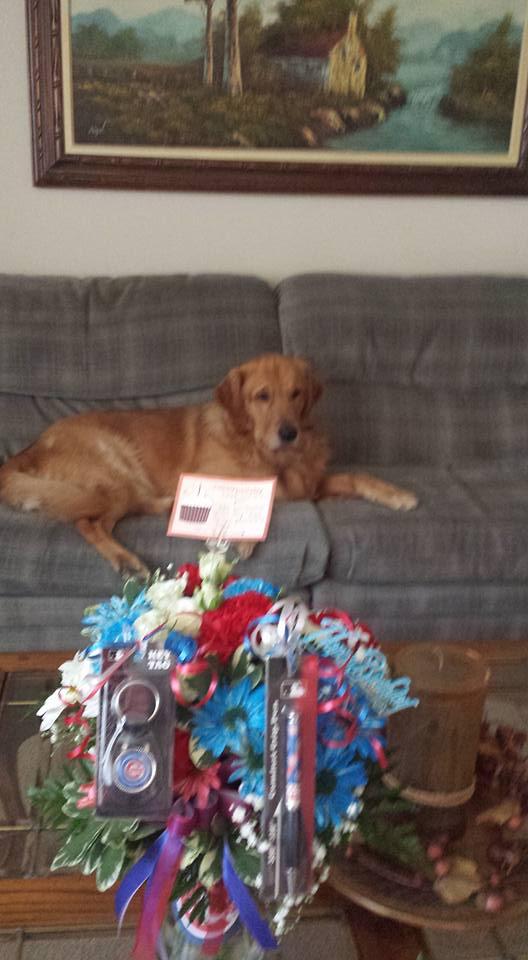 Very nice floral arrangement w/ cool Cubs stuff. (See attached) Thanks guys!! Very much appreciated. Even Nelson had to jump up & get in the photo. See ya soon. Love, DAVE