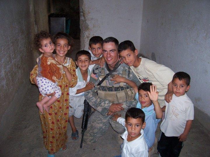Jason and some Iraqi kids. (1st tour)
