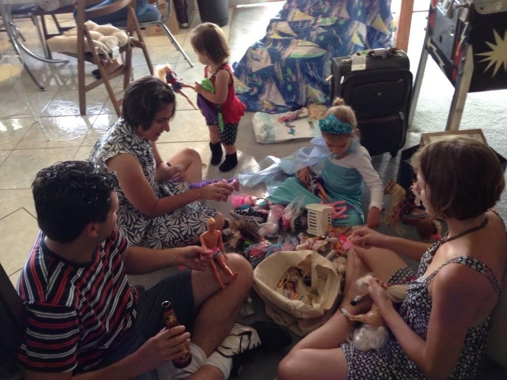 Playing Barbie dolls! What a daddy won't do for his little girls!