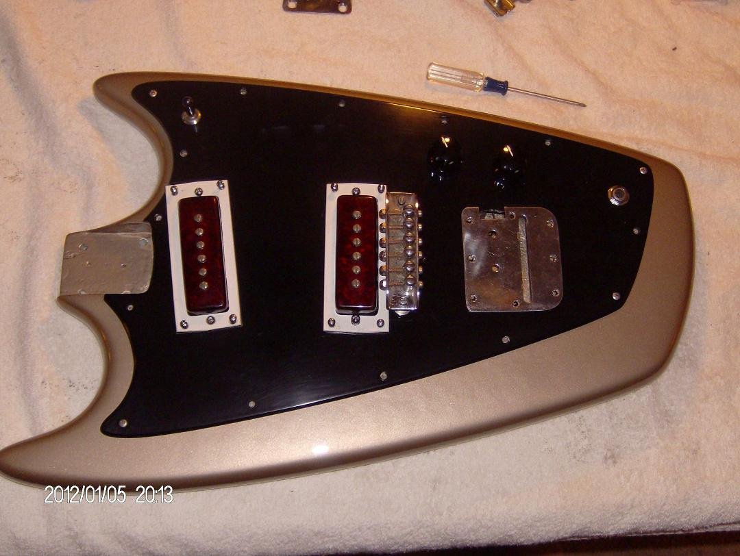 I lovingly cleaned all the electronics, but the guy who gave me this guitar had stripped the body finish off so in order to restore it I finished it with a goldtop finish! My intent was not to do a origional but this was fo