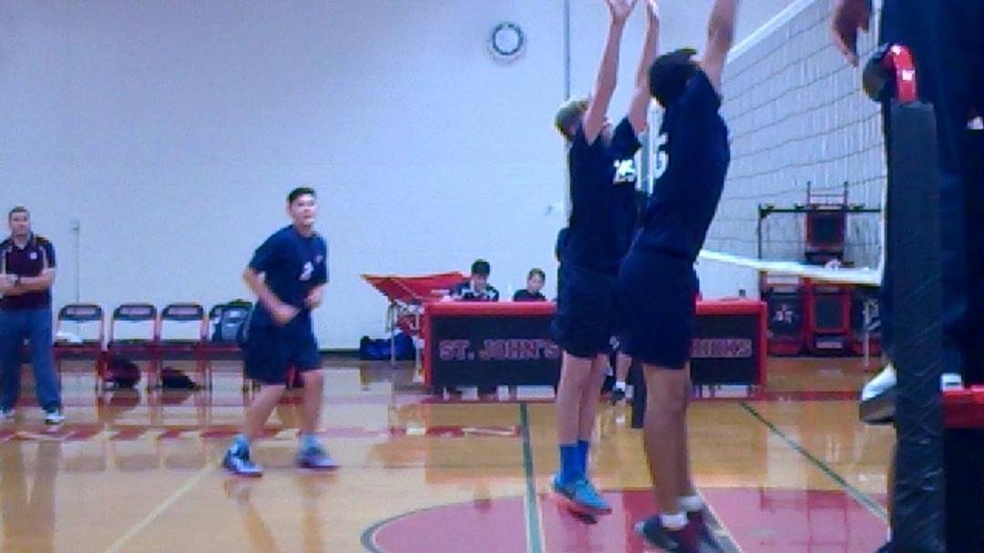 Watching Logan Brunner play vball at St John school
