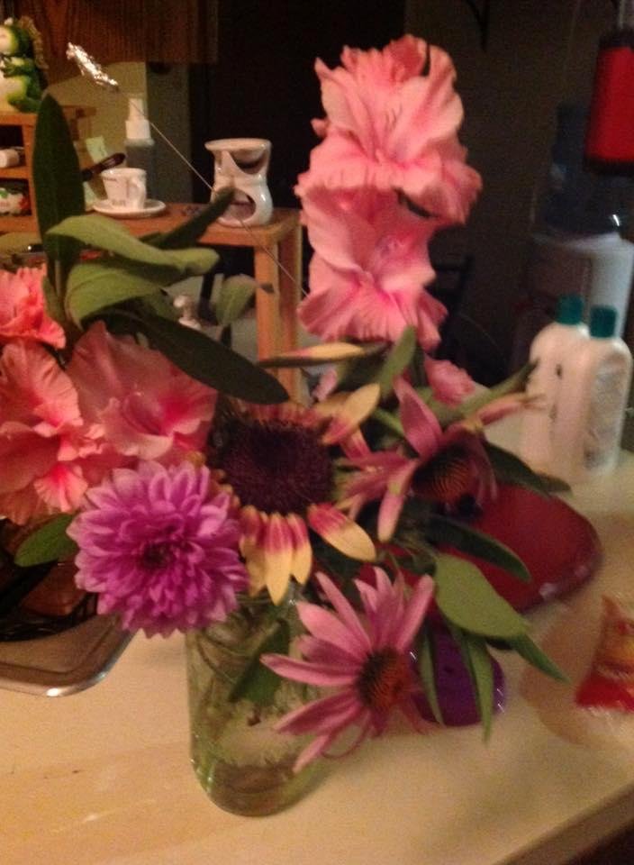 I am so blessed!. My neighbors gave me these beautiful flowers from their garden tonight.