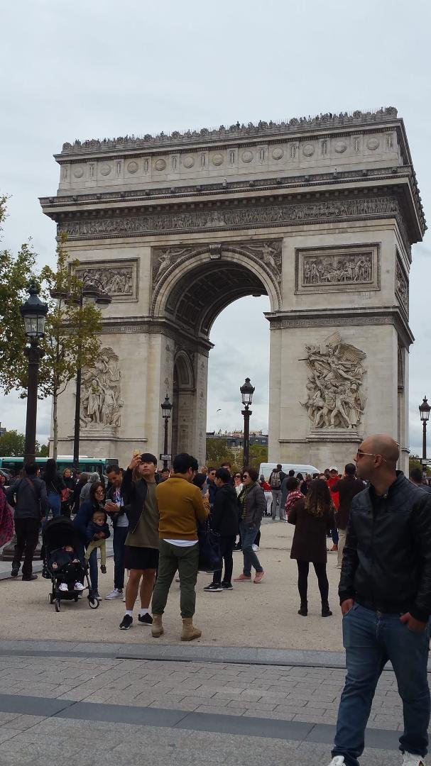 At arc de triomphe, can't believe I'm here. Hordes of tourists