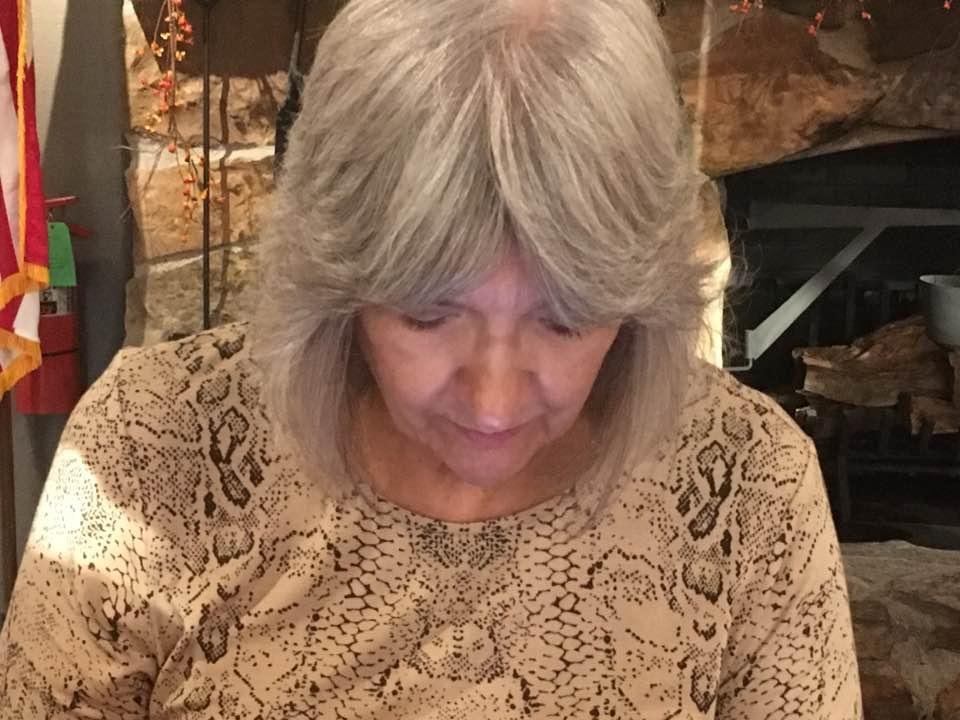Pat is Deep in concentration on the menu at Crackerbarrel