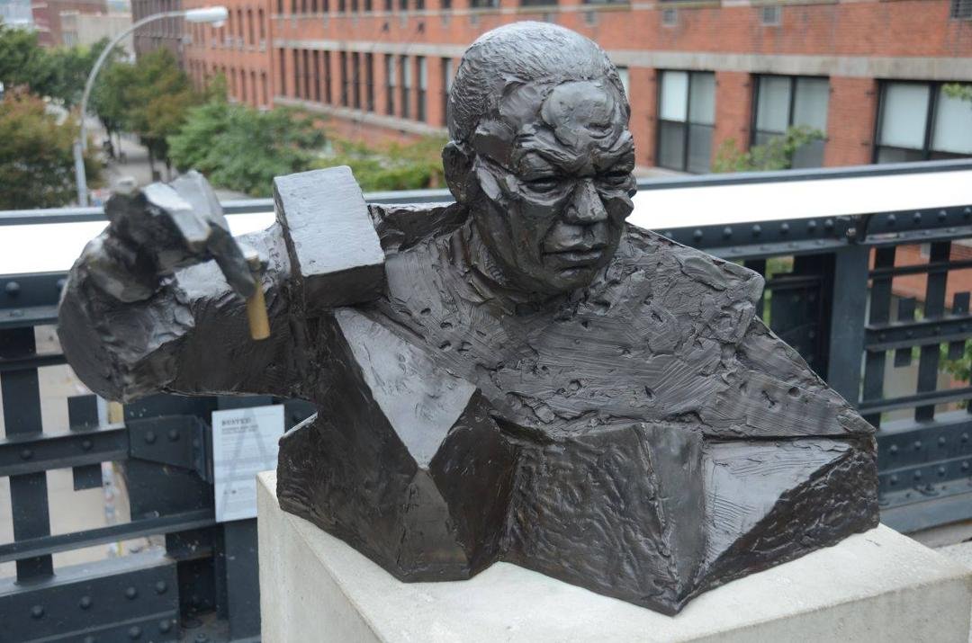 NYC sculpture of Colin Powell holding yellowcake
