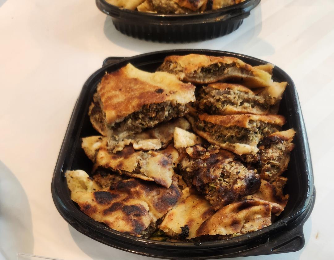 Hawawshi is an Egyptian street food made with seasoned minced meat stuffed into pita bread.