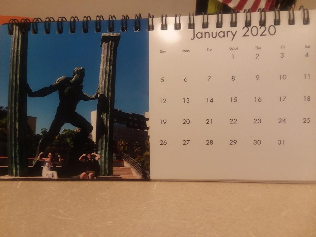 My kids under Hercules in Ceuta, Morocco.  The calendar was a Christmas gift.