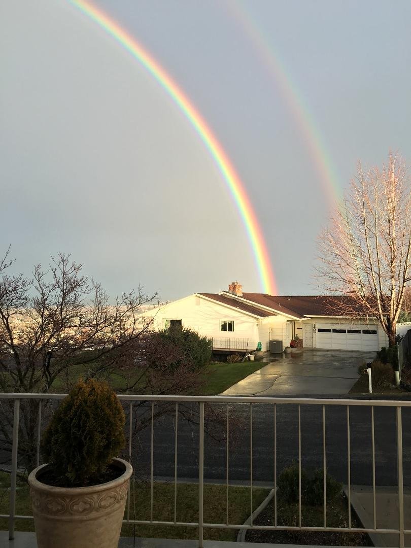 A beautiful rainbow is a welcome sight after a mostly gray and dreary day! This pic doesn't do justice to the vibrant colors that gracefully arch the sky.