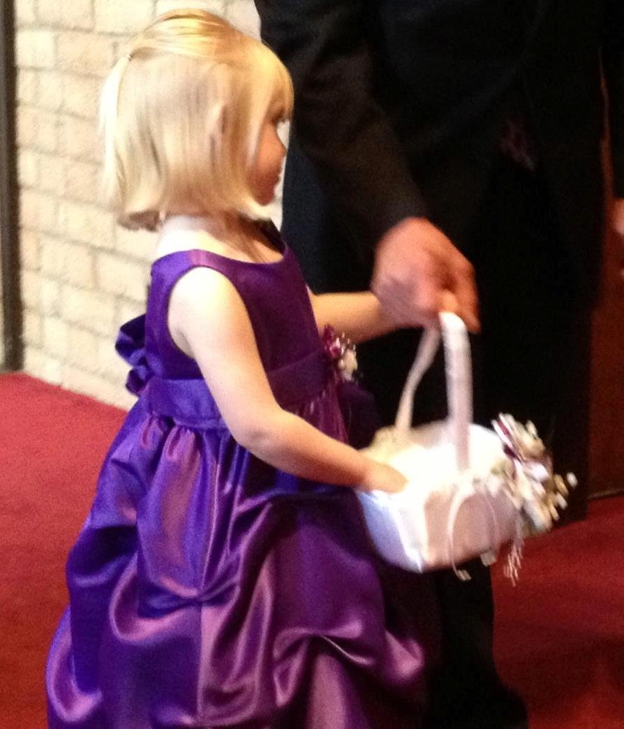 Abby about to walk down the aisle with her daddy. Better pictures were taken but I'll have to wait to post them.