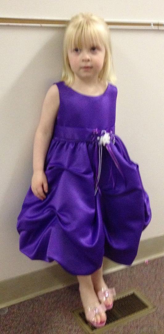 Abby all ready for her debut as a Flower Girl. Notice the princess dress up heels. She wore them the entire day!