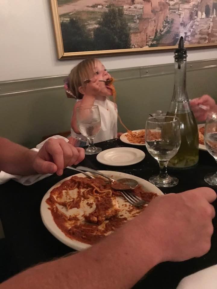 Addie Jo eating spaghetti at Lo Sole mio for Daddies Birthday....